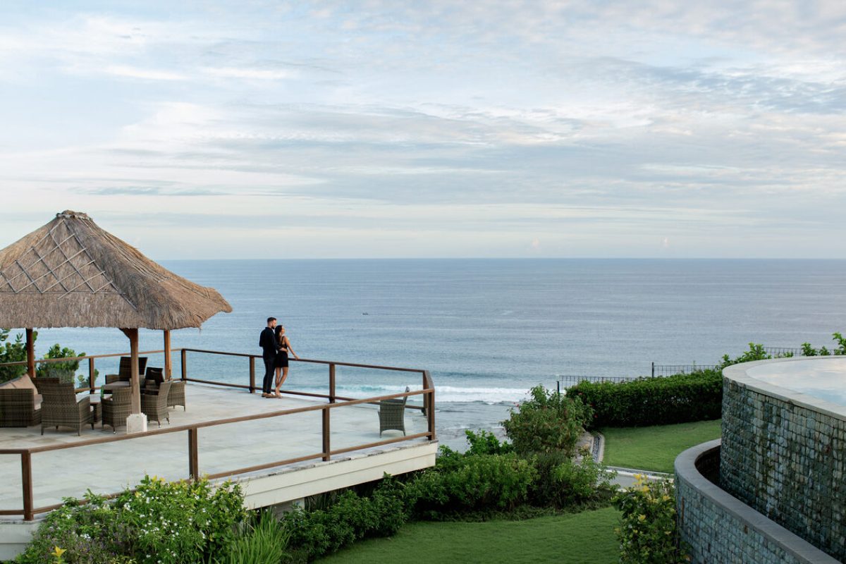 beautiful couple look at the ocean. High quality photo