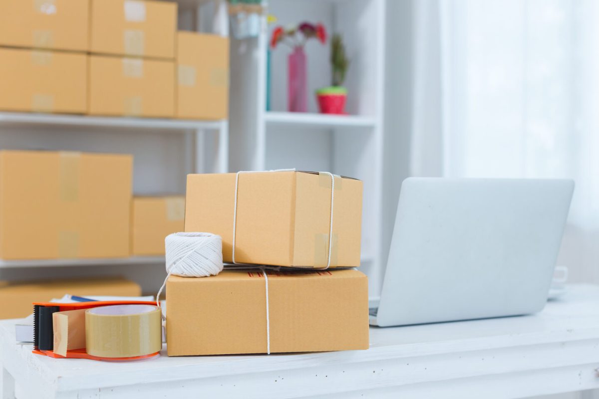 business owner working at home office packaging on background. online shopping SME entrepreneur working Young Women happy after new order from customer.