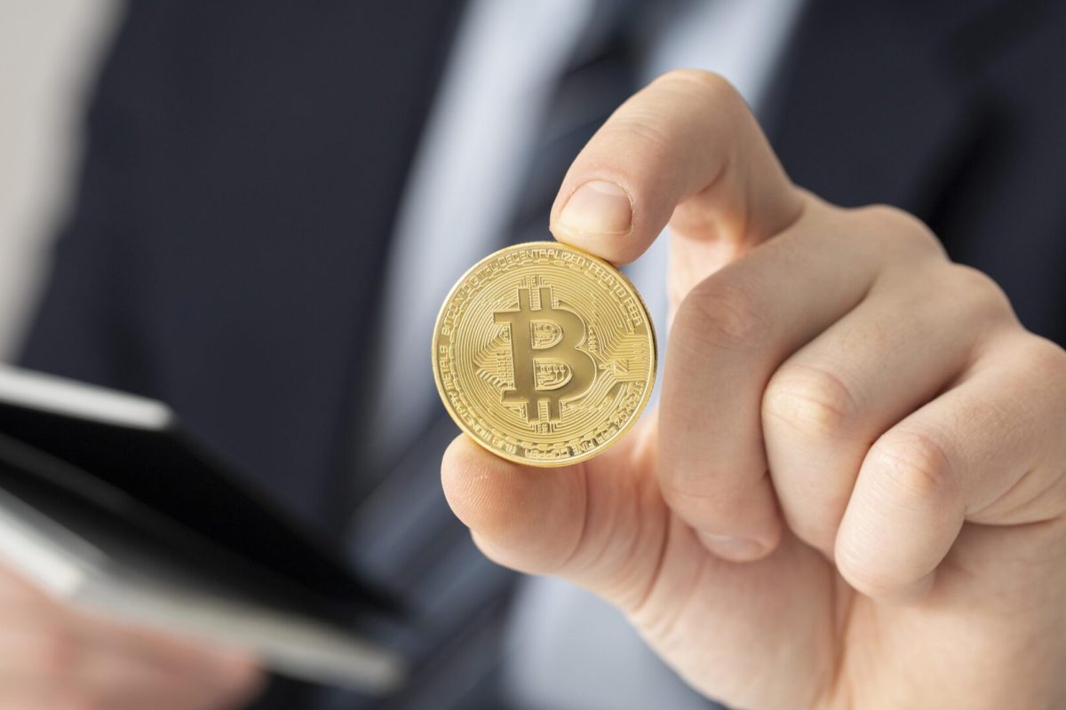 businessman-holding-bitcoin-close-up