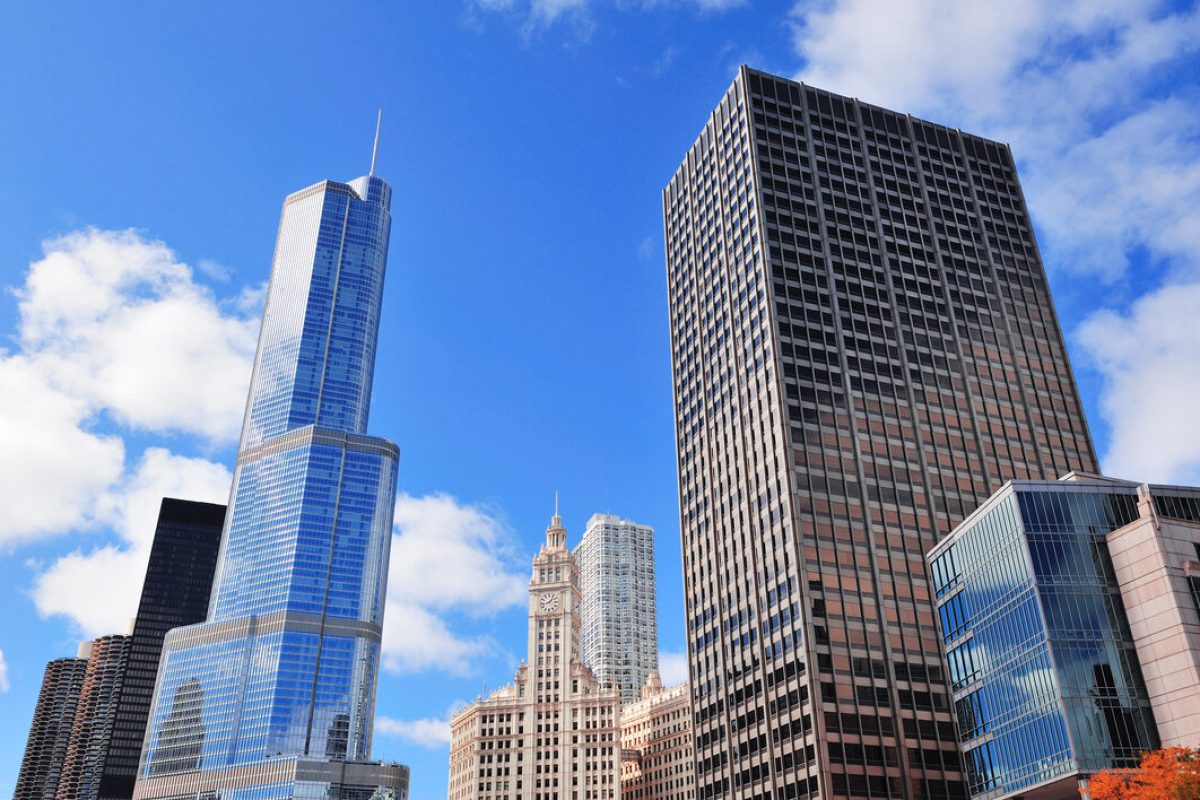 Chicago city downtown urban skyline with skyscrapers and cloudy blue sky.