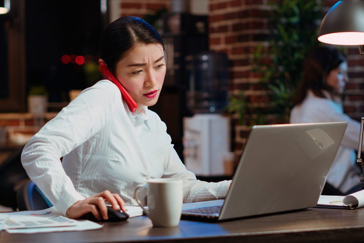 Company secretary taking phone call at office desk, answering customer inquiries while working on laptop, multitasking. Stressed worker having conversation on telephone and crosschecking data SSUCv3H4sIAAAAAAAAA01Ru7LcIAz9F2ozwQaD2TJFukyadHdSCJB3yWVhx+Dc2dnxv0fex01o0ONIOjq6sRjYgQ3jgKCmwJ2cBVdaAbdOBz7LYdajkW5UhnUsQEN26KXUygr6em1HQa9jDmr07HBjMaW1tgVaLJkdKLNgDrjcTQyxlSVCIm/rWG3Q1oqVysjz1PtI2bv/6vd22+NE8OtaY8Zav3yLGbJHIlNXR4kf7jf6VtnWvaA/0Z9ySeV4/QR9j9VjSpCxrP9DPwFs+9UxOGL2153NttNOCHdyb0zIWUkhZh6077lS2nLXh55L0KKf5mnSY6BWYL3T1gguwE9cDcqSiM7zyYxWGar3qAhmtLBCa+Cyf3RTHEhF3pvgtRy9s4MnGM7WAg4TN2ZwXIWAHJwXfFLKhBGsmaRgxPr9o+FyfopY2mnXmvYra27L9bFjKuUCLtHpZkgVO3aCWgkQngEqvCzRx3x8noIuWM4PO5e2i3CXqhX/HsNz1ON6p0jRfc6NrZdUIGB4pld3jq293AX/RPz4h9627S9ZLN18ewIAAA==