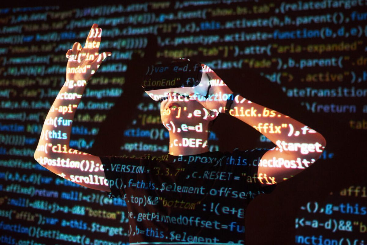 Double exposure of a caucasian man and Virtual reality VR headset is presumably a gamer or a hacker cracking the code into a secure network or server, with lines of code