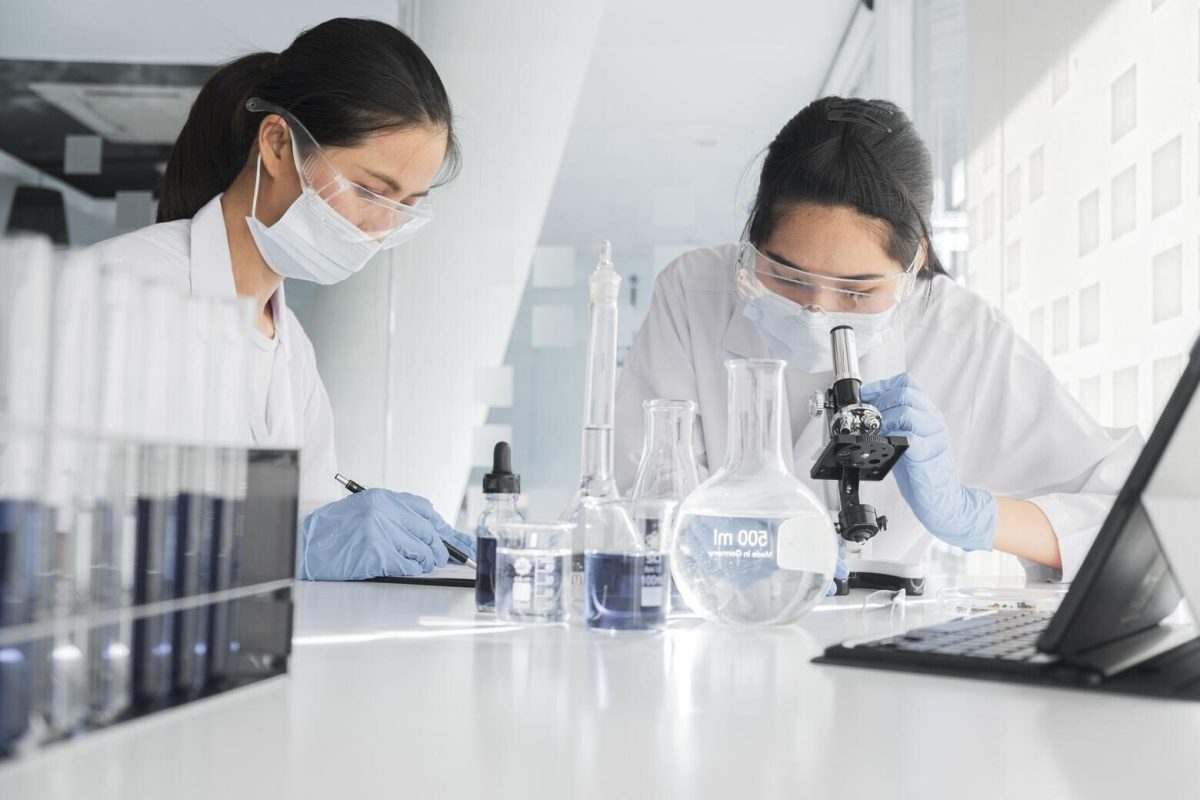front-view-asian-women-working-together-chemical-project (1)